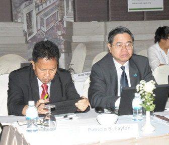 Dr. Faylon (left), with Dr. Nguyen Van Bo of Vietnam (right), studies his presentation on the country’s paper regarding climate smart agriculture in the Philippines.