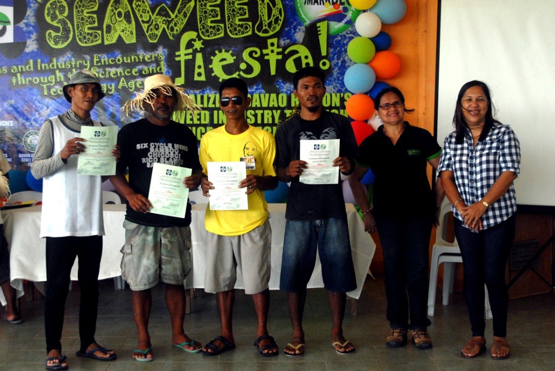 Mr. Orlando Adani (center), winner of the Bangkarera or boat race, with the consolation prize winners.